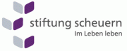 graue Schrift auf weißem Grund - Stiftung Scheuern - Im leben leben, daneben drei stilisierte Würfel.